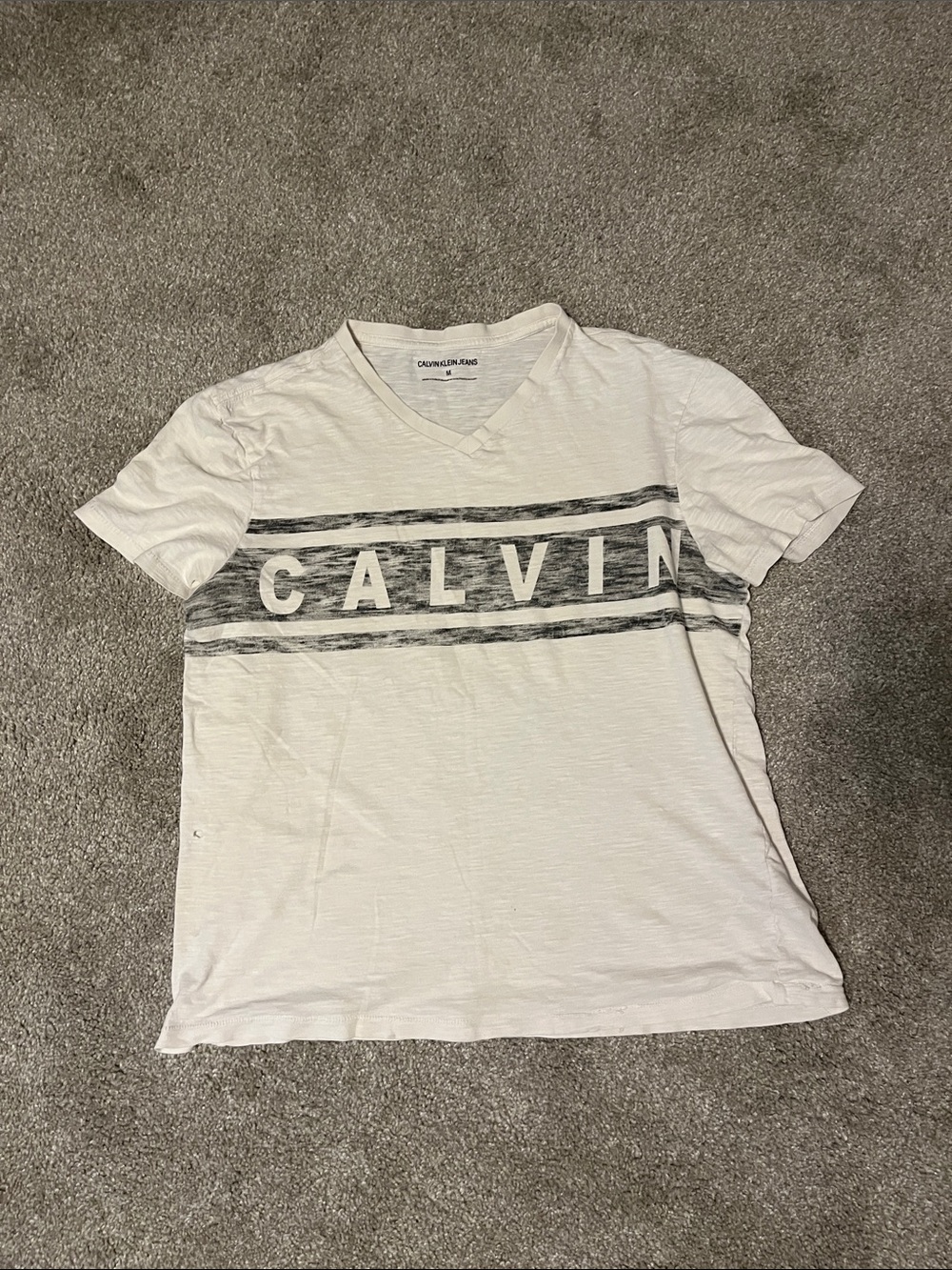 Calvin Klein Cream V-Neck Tee with Black Stripes